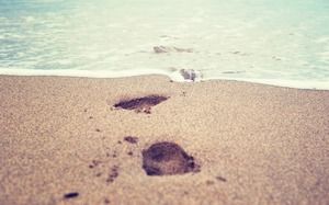 Obraz tła PPT odcisk stopy na plaży